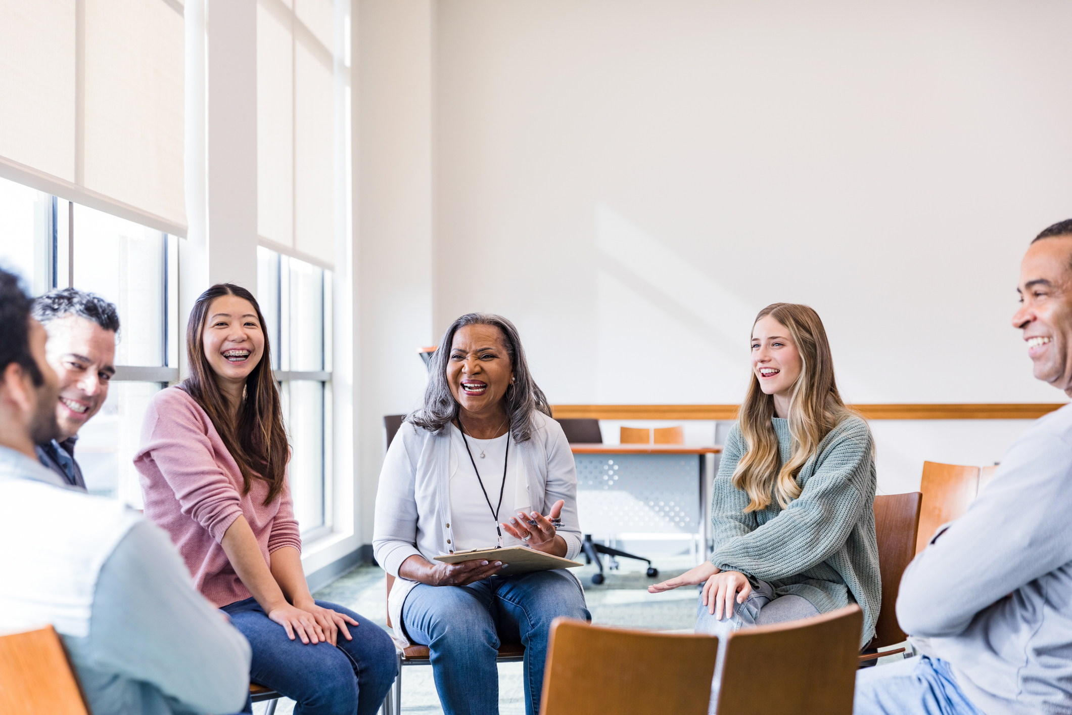 Parents laughing together during a group class